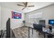 Spare bedroom featuring a ceiling fan and window offering great natural light, can also be used as a home office at 7169 Sweet Gum Ct, Lithonia, GA 30058