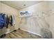 Spacious walk-in closet with ample shelving and hanging space for optimal organization at 7169 Sweet Gum Ct, Lithonia, GA 30058