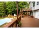 Lovely backyard with a refreshing swimming pool, deck, and playset at 1020 Travitine Trl, Loganville, GA 30052