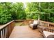 Cozy deck offers a peaceful view of the private, tree-lined backyard, ideal for unwinding at 1020 Travitine Trl, Loganville, GA 30052