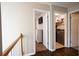 Hallway view showcases the laundry room and bedroom entrance with brown trim at 1020 Travitine Trl, Loganville, GA 30052