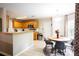 Eat-in kitchen features wood cabinets, stainless steel appliances, tile flooring, and a breakfast nook at 1020 Travitine Trl, Loganville, GA 30052