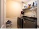 Functional laundry room with modern washer and dryer units at 1020 Travitine Trl, Loganville, GA 30052
