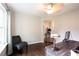 Bright home office featuring a large window, stylish desk, and elegant decor at 1020 Travitine Trl, Loganville, GA 30052