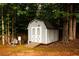 Backyard features shed that is perfect for storing equipment and supplies at 1020 Travitine Trl, Loganville, GA 30052