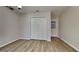 Spacious bedroom with wood flooring, ample storage, and a door leading to the backyard at 10961 Big Sky Dr, Hampton, GA 30228