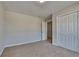 This bedroom features plush carpet, a double door closet and neutral walls at 10961 Big Sky Dr, Hampton, GA 30228