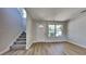 Inviting entryway with new wood flooring and staircase leading to the upper level at 10961 Big Sky Dr, Hampton, GA 30228