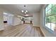 Modern kitchen with stainless steel appliances, white cabinetry, and ample natural light at 10961 Big Sky Dr, Hampton, GA 30228