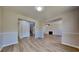 Spacious living room featuring wood flooring and a decorative fireplace at 10961 Big Sky Dr, Hampton, GA 30228