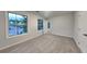 Cozy bedroom with plush carpeting, natural light and an open doorway at 2352 Benson Rdg, Lithonia, GA 30058