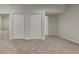 A well-lit bedroom with neutral tones and plush carpeting and closet, perfect for relaxation at 2352 Benson Rdg, Lithonia, GA 30058