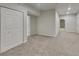 Spacious bedroom featuring neutral tones, plush carpeting and a closet for optimal storage at 2352 Benson Rdg, Lithonia, GA 30058