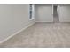 Neutral bedroom with carpet featuring a door with view into a large window at 2352 Benson Rdg, Lithonia, GA 30058