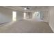 A large bonus room with plush carpeting, ceiling fan and well-lit open space at 2352 Benson Rdg, Lithonia, GA 30058