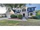 Charming two-story home with dark shutters, landscaped yard and attached two car garage at 2352 Benson Rdg, Lithonia, GA 30058