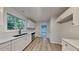 Modern kitchen with stainless steel appliances, ample storage and wood look flooring at 2352 Benson Rdg, Lithonia, GA 30058