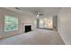 Open-concept living room featuring a fireplace and an eat-in kitchen at 2352 Benson Rdg, Lithonia, GA 30058