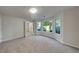 Bright living room with plush carpet and large windows offering natural light at 2352 Benson Rdg, Lithonia, GA 30058