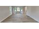 Spacious living room with lots of light, and beautiful wood-look floors at 2352 Benson Rdg, Lithonia, GA 30058