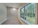 Well lit office space featuring modern large window, neutral walls, and plush carpeting at 2352 Benson Rdg, Lithonia, GA 30058
