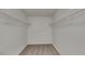 Spacious walk-in closet with ample storage space and wire shelving units at 2352 Benson Rdg, Lithonia, GA 30058