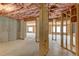 Unfinished basement with concrete foundation, pink insulation, and wood framing at 3066 Reserve Ct Sw, Conyers, GA 30094