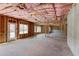 Large unfinished basement with pink insulation, concrete foundation, and wood framing at 3066 Reserve Ct Sw, Conyers, GA 30094