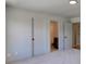 View of an ensuite bathroom through bedroom doorway, offering convenience and privacy at 3066 Reserve Ct Sw, Conyers, GA 30094