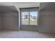 Spacious walk-in closet with natural light and ample shelving, providing generous storage space at 3066 Reserve Ct Sw, Conyers, GA 30094
