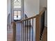 Foyer featuring wood floors and wrought iron staircase at 3066 Reserve Ct Sw, Conyers, GA 30094