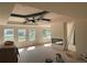 Spacious room with a unique tray ceiling design, fireplace, and large windows offering picturesque views at 3066 Reserve Sw Ct, Conyers, GA 30094