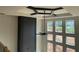 Bedroom with a statement ceiling design, a modern ceiling fan, and an abundance of natural light at 3066 Reserve Sw Ct, Conyers, GA 30094