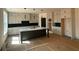 Contemporary kitchen with custom cabinets, marble counters, and a central island, ready for finishing touches at 3066 Reserve Sw Ct, Conyers, GA 30094