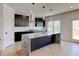 Modern kitchen with island, stainless steel appliances, and ample counter space at 3066 Reserve Sw Ct, Conyers, GA 30094