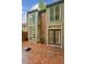 Charming brick patio off the rear of the home with large windows and door, perfect for outdoor entertaining at 68 Willow Ne Gln, Atlanta, GA 30342