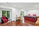 Bright bedroom with hardwood floors, large windows overlooking green trees, and comfortable seating areas at 68 Willow Ne Gln, Atlanta, GA 30342