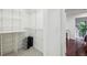 Organized walk-in closet with shelving units and ample storage space for luggage at 68 Willow Ne Gln, Atlanta, GA 30342