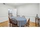 Formal dining room with wood flooring and a round dining table set for a cozy gathering at 68 Willow Ne Gln, Atlanta, GA 30342