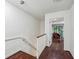 Hallway featuring hardwood floors leading to a room with a comfortable chair and view at 68 Willow Ne Gln, Atlanta, GA 30342