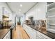 Modern kitchen with stainless steel backsplash, countertops, and appliances with adjacent dining area at 68 Willow Ne Gln, Atlanta, GA 30342