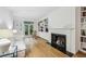 Bright living room features a fireplace, built-in bookshelves, and French doors leading to the outside at 68 Willow Ne Gln, Atlanta, GA 30342