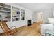 Bright living room with hardwood floors, built-in shelving, and a cozy fireplace, creating an inviting atmosphere at 68 Willow Ne Gln, Atlanta, GA 30342