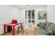 Bright home office with large window, red desk, and sitting area, perfect for focused work at 68 Willow Ne Gln, Atlanta, GA 30342