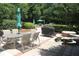 Outdoor patio features dining and grilling areas, benches and lush landscaping, ideal for entertaining at 68 Willow Ne Gln, Atlanta, GA 30342