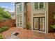 Brick patio with floor-to-ceiling windows and glass doors at 68 Willow Ne Gln, Atlanta, GA 30342