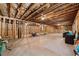 Unfinished basement with concrete floor, exposed ceiling, and framing, ready for customization at 131 Forsyth Park Ln, Woodstock, GA 30188