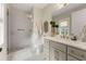 Stylish bathroom with quartz countertop, walk-in shower, and updated bronze fixtures at 131 Forsyth Park Ln, Woodstock, GA 30188