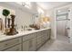 Bright bathroom features double vanity, modern fixtures and a separate shower room at 131 Forsyth Park Ln, Woodstock, GA 30188