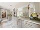 Bathroom with double vanity, stone countertops, and modern fixtures at 131 Forsyth Park Ln, Woodstock, GA 30188